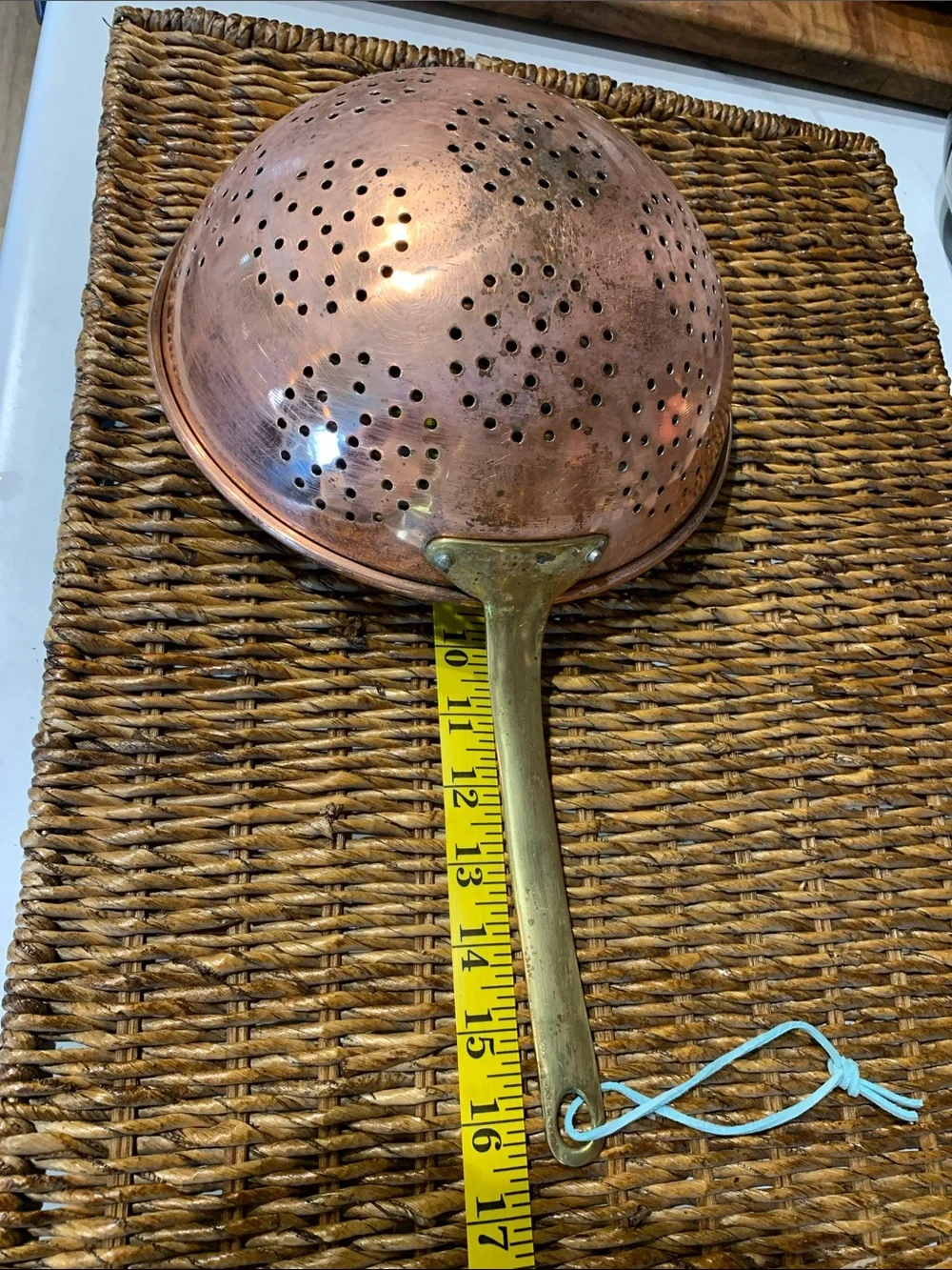 vintage copper colander strainer with a long brass handle 16”L